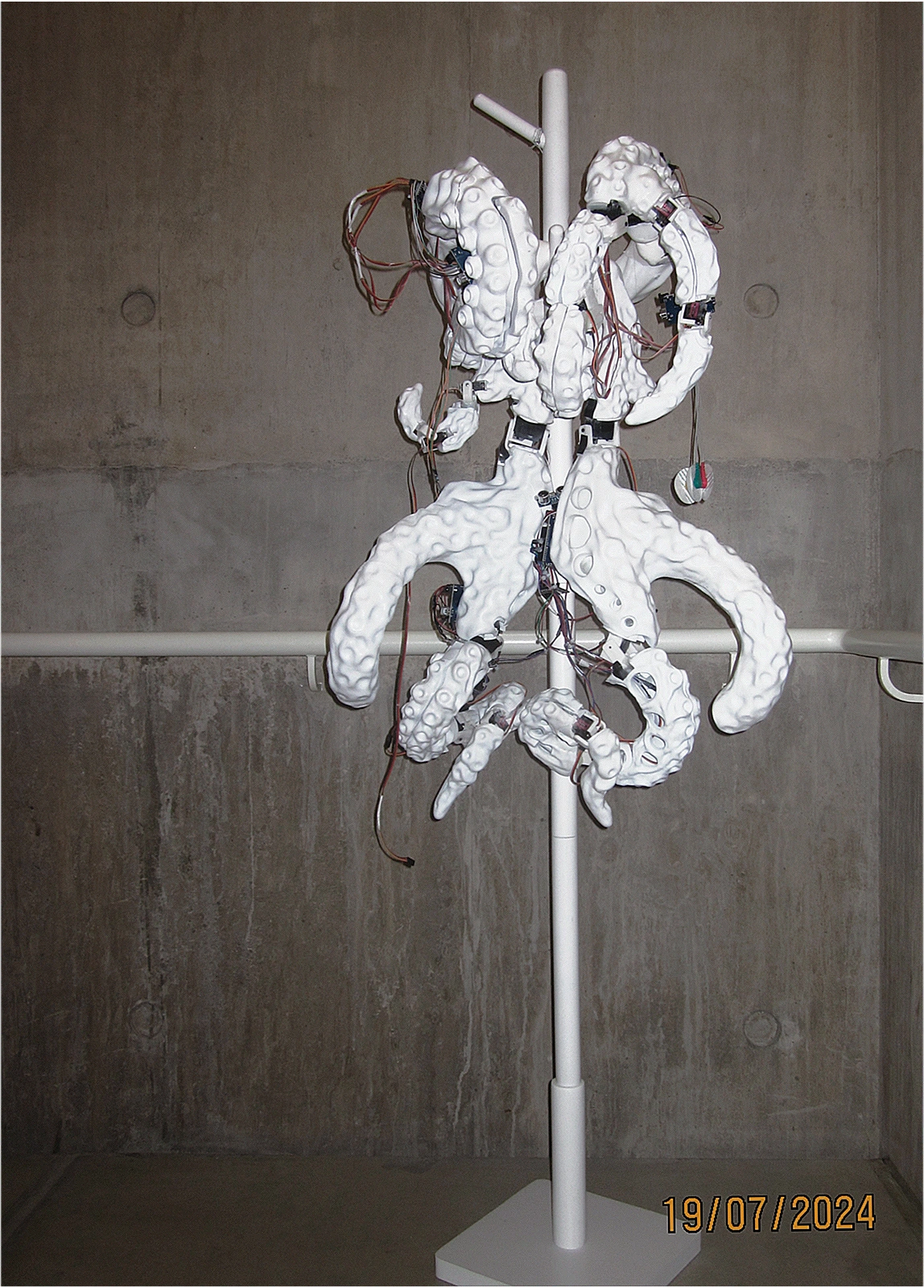 Complete physical wearable prototype on its display stand